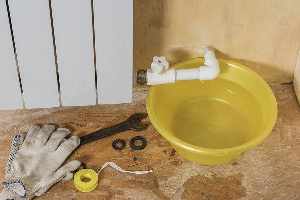 gloves-repair-tools-near-leaking-heating-system-accident-heating-system-private-house-heating-radiator.jpg