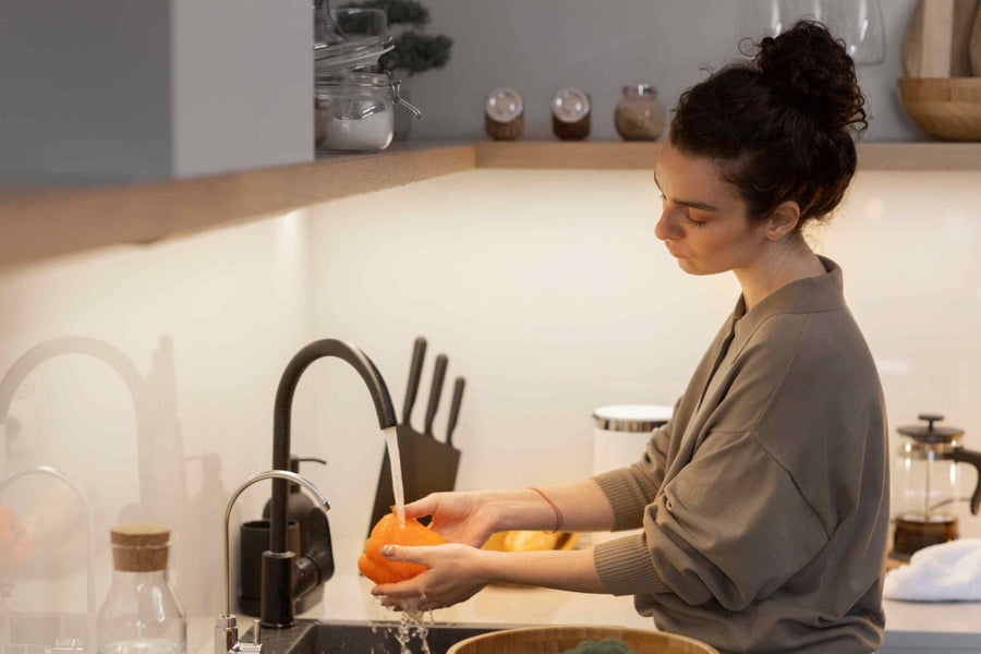 a-woman-washing-vegetables-with-filtered-water.jpg