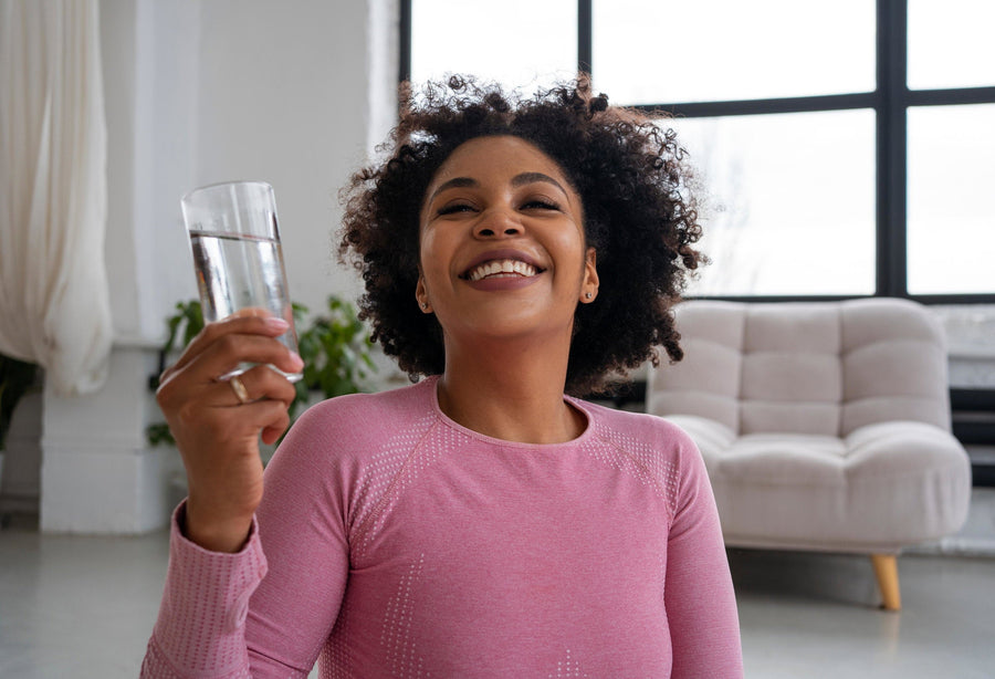 medium-shot-fit-woman-drinking-water-min.jpg