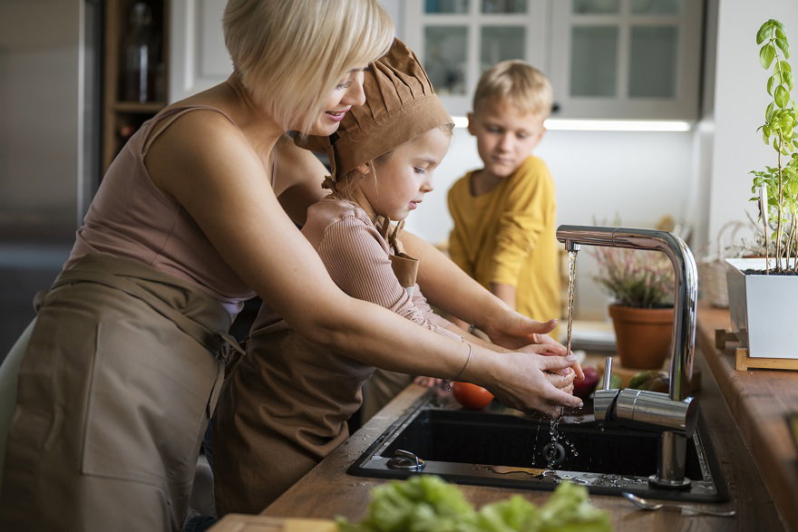 mother-teaching-her-children-cook-home.jpg