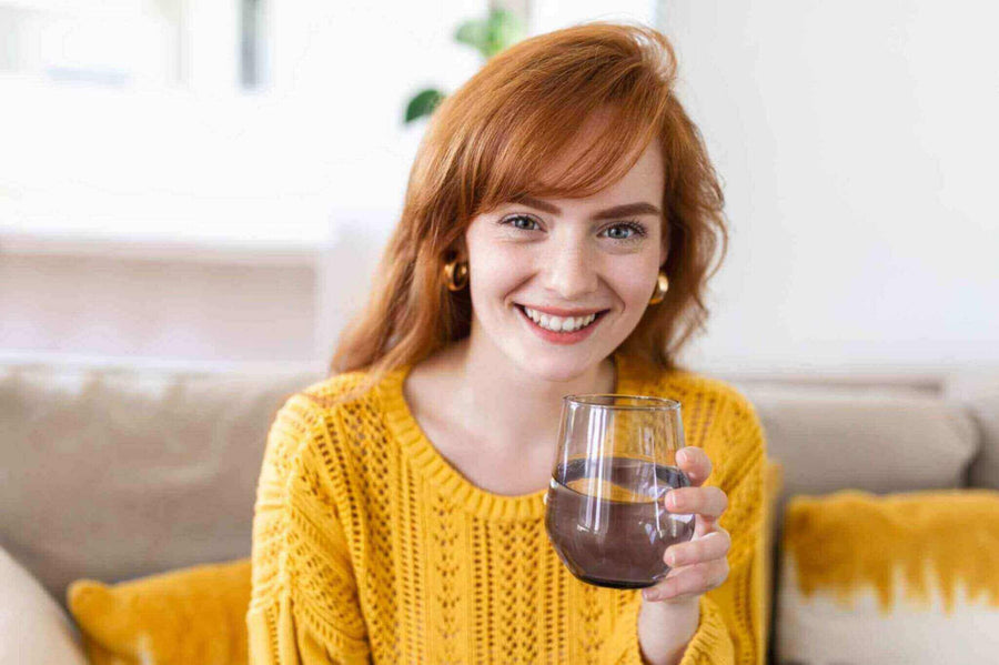a-woman-holding-a-glass-of-filtered-water.jpg