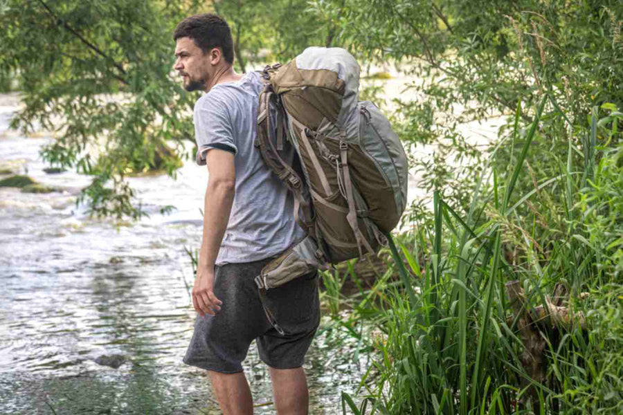 a-man-exploring-the-outdoors-with-a-backpack.jpg